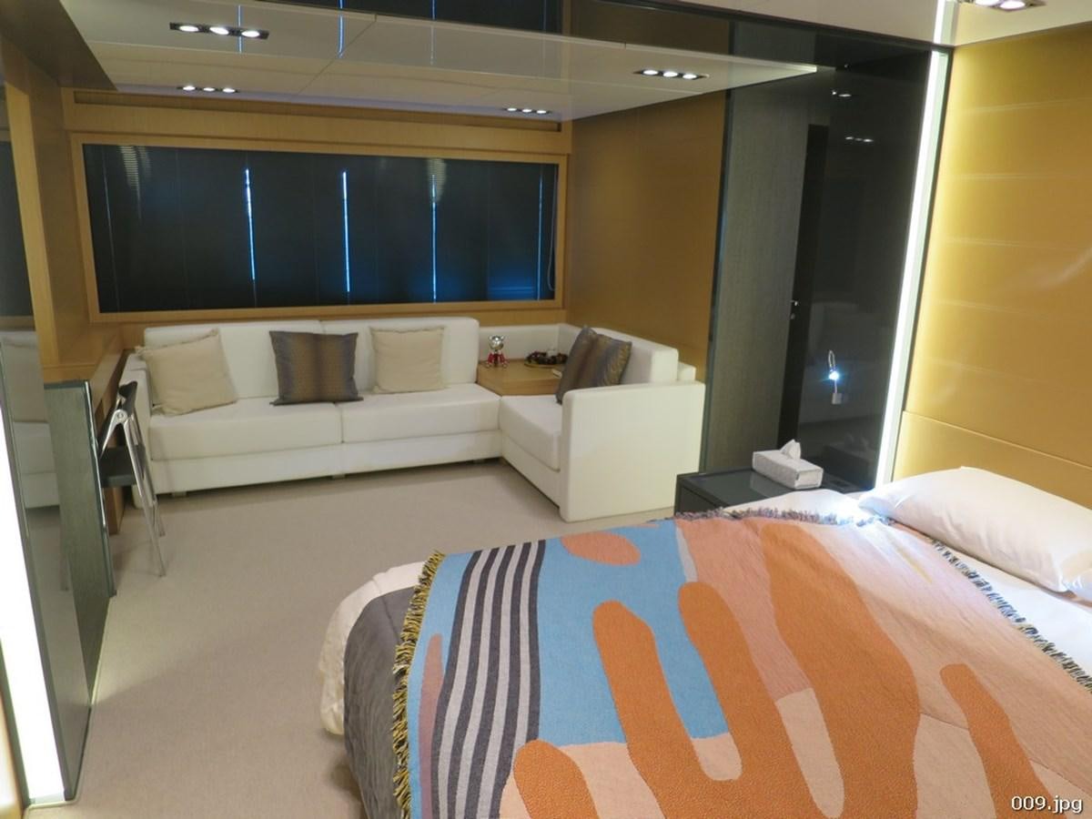 a room with a bed and a couch aboard RIVA 86 DOMINO Yacht for Sale