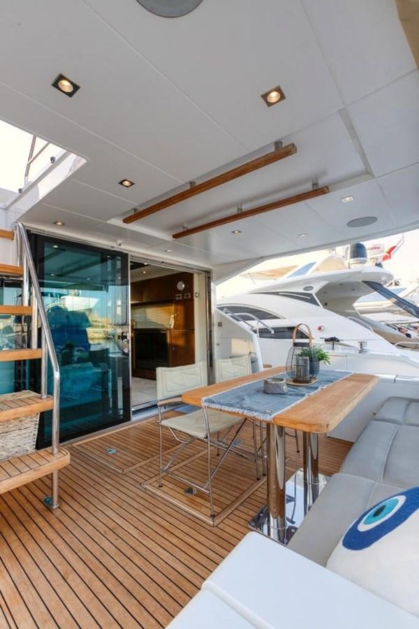 a room with a table and chairs aboard LANA 1 Yacht for Sale