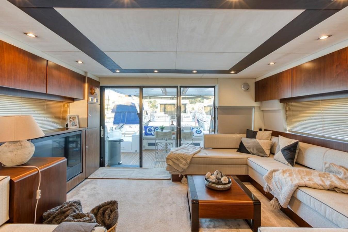 a living room with a large glass door aboard LANA 1 Yacht for Sale