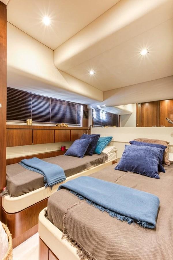 a room with a bed and a window aboard LANA 1 Yacht for Sale