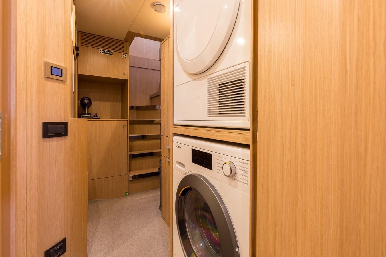 a laundry room with a washer and dryer aboard RIES Yacht for Sale