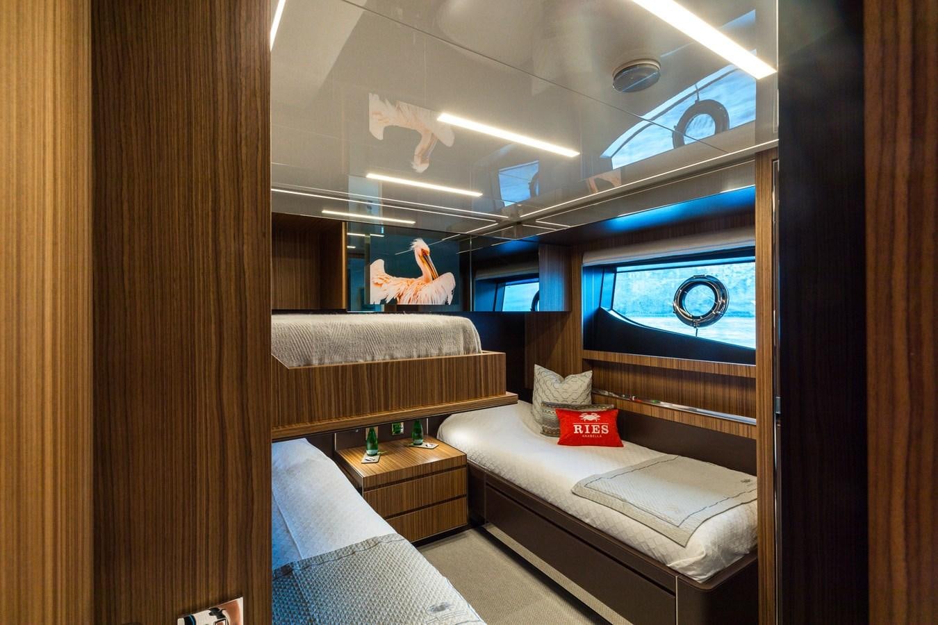a room with a bed and a television aboard RIES Yacht for Sale