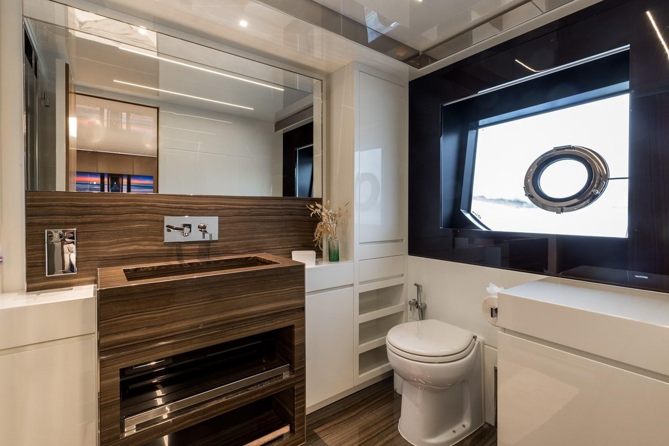 a bathroom with a large mirror aboard RIES Yacht for Sale