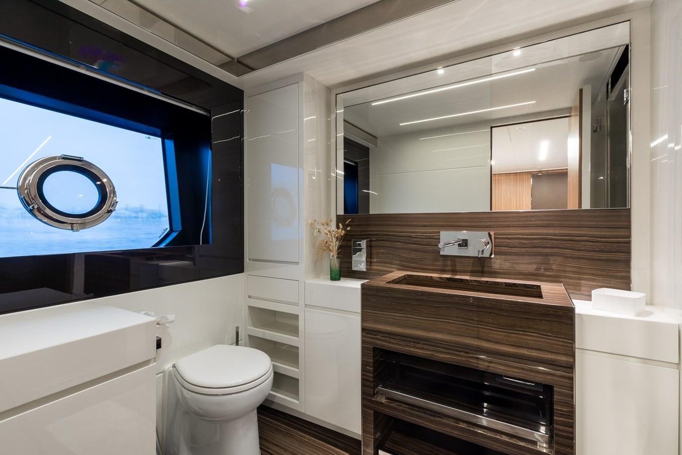 a bathroom with a large mirror aboard RIES Yacht for Sale