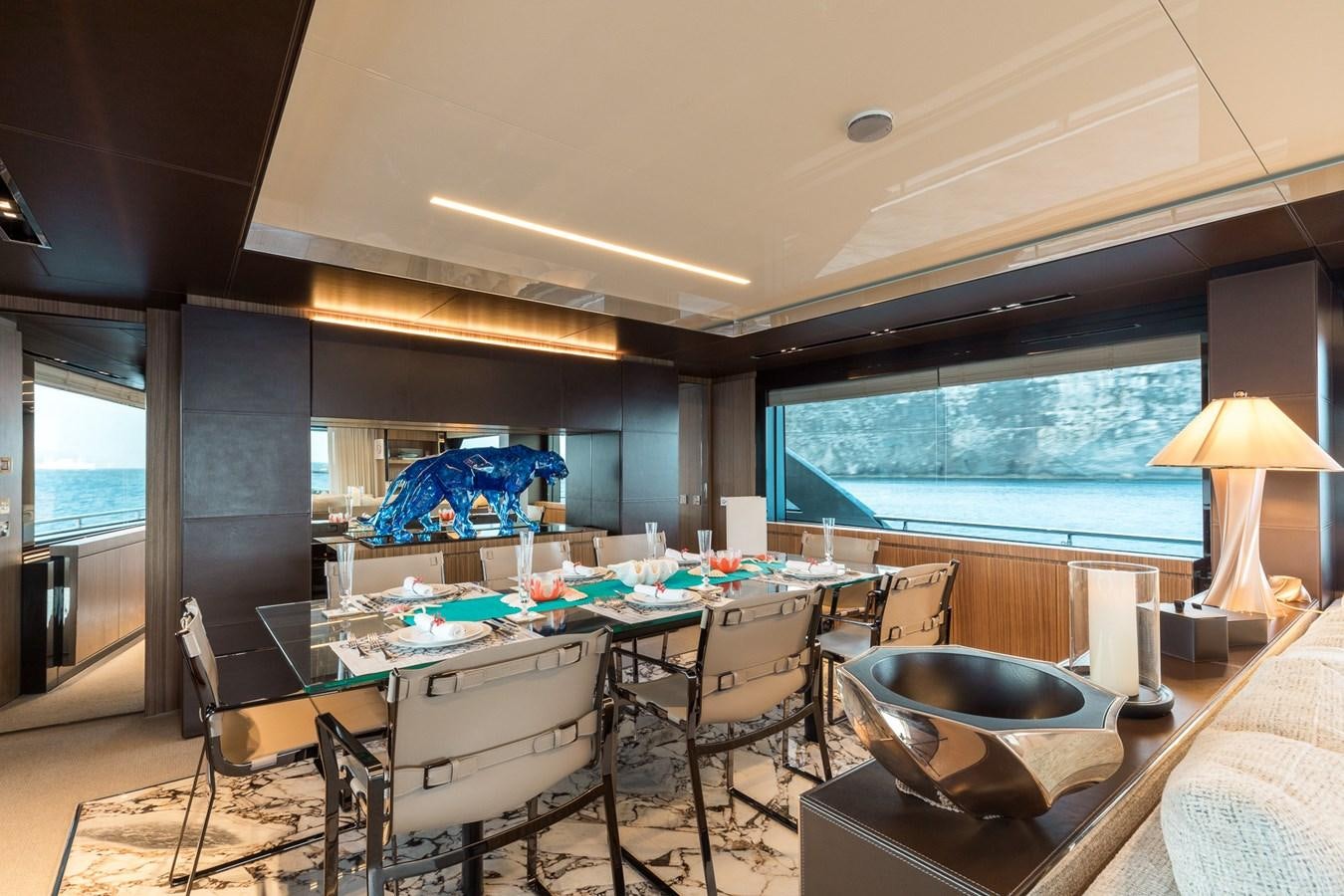 a room with a table and chairs aboard RIES Yacht for Sale