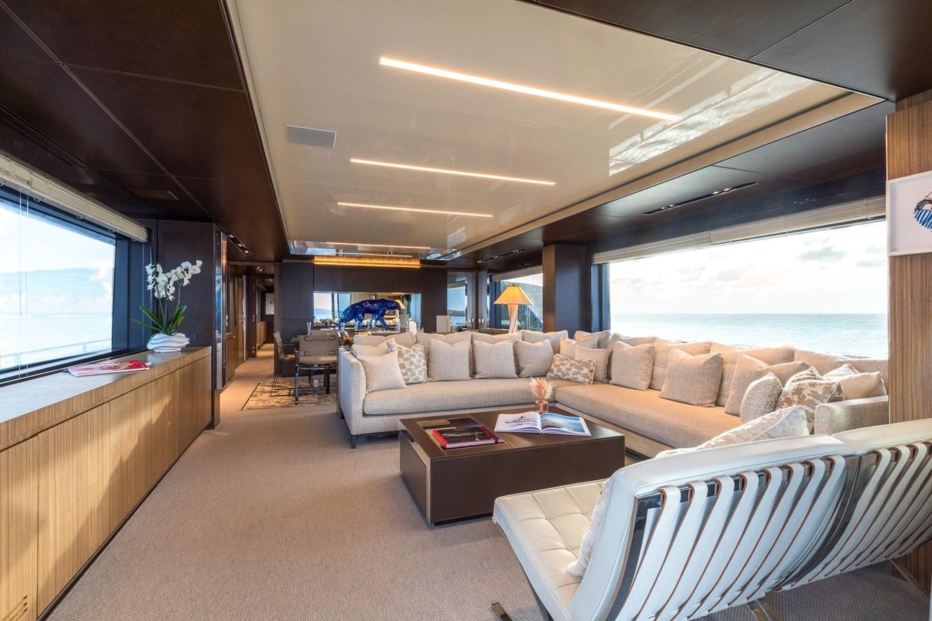 a living room with a large window aboard RIES Yacht for Sale
