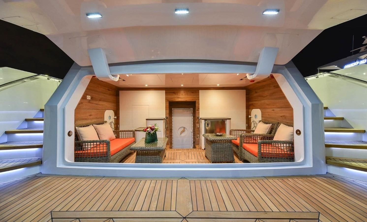 a large room with a wood floor and a couch aboard 'H Yacht for Sale