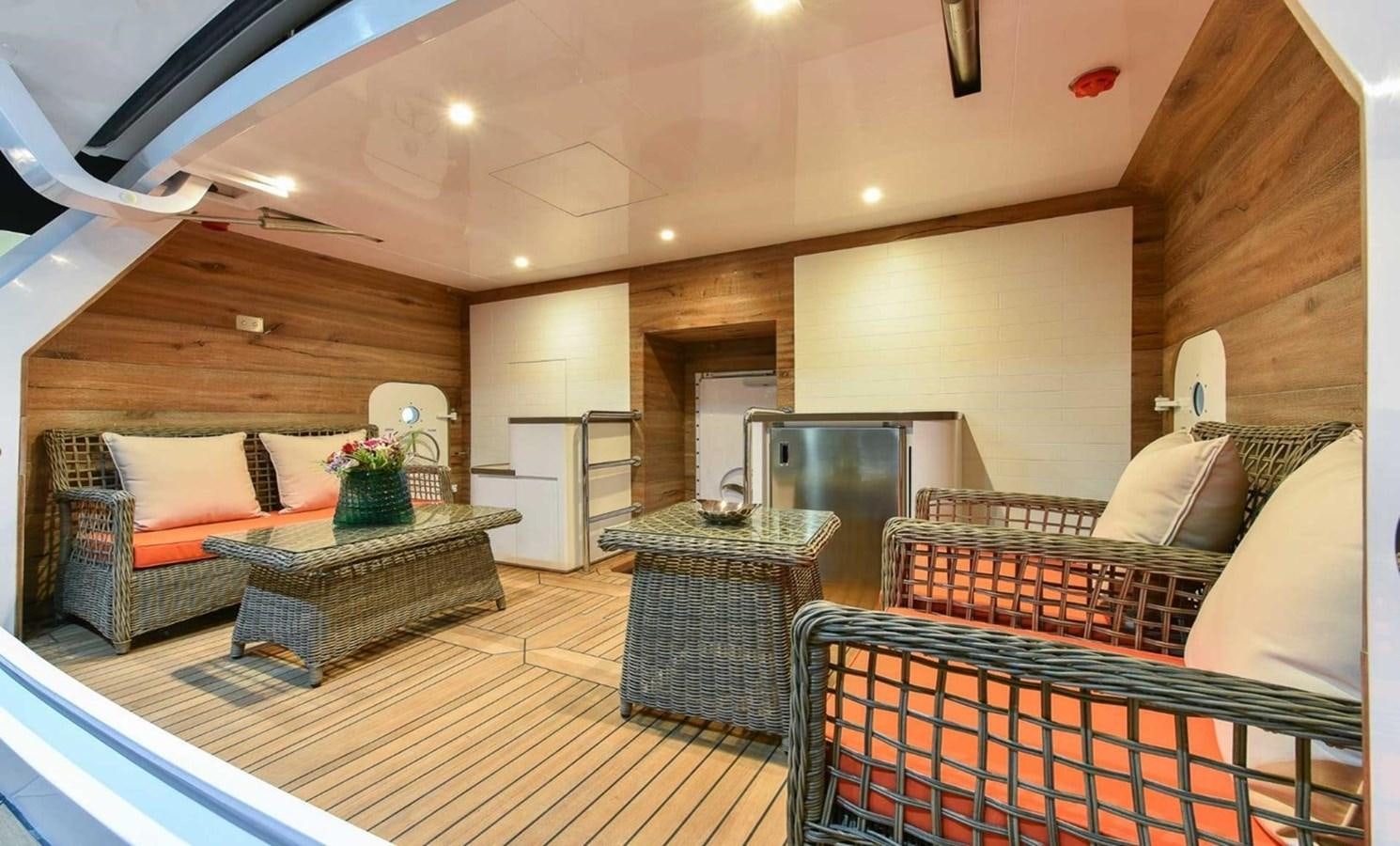 a living room with a wood floor aboard 'H Yacht for Sale