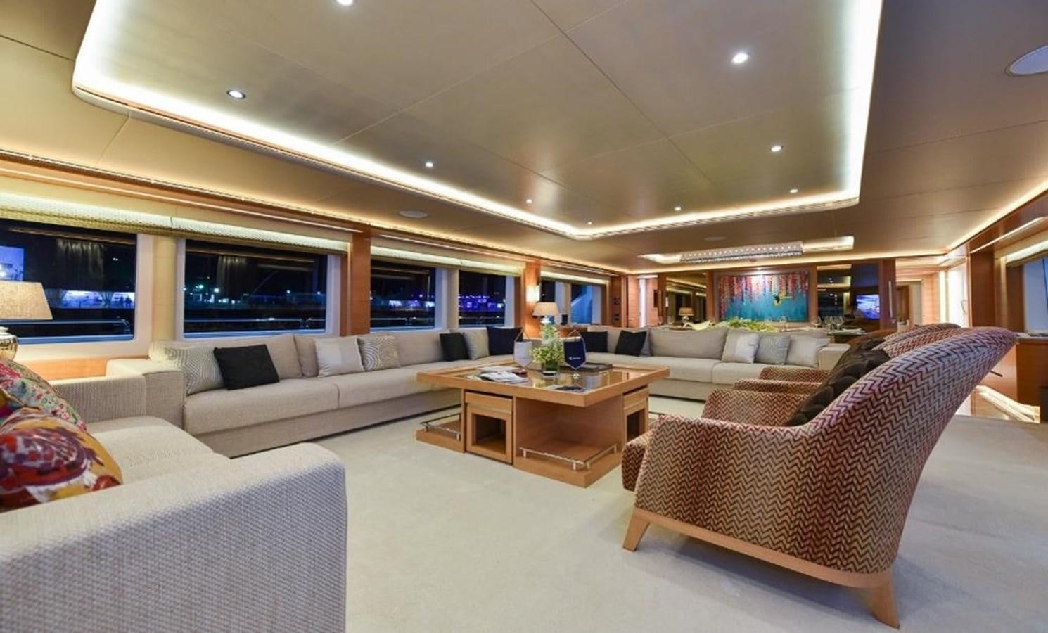 a living room with a couch and a table aboard 'H Yacht for Sale