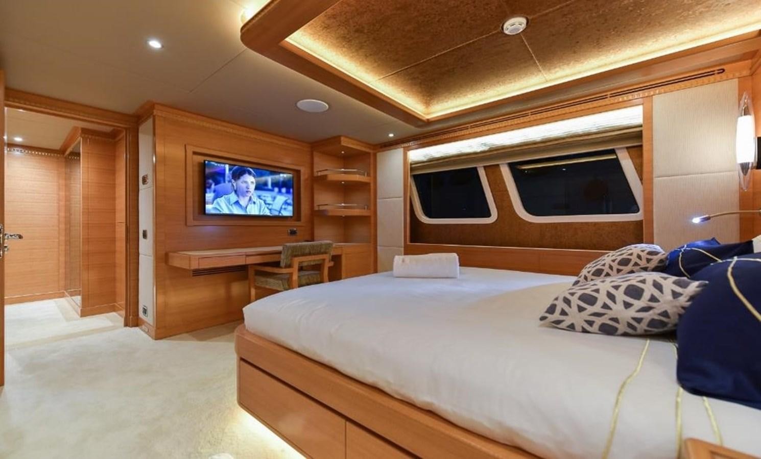 a bedroom with a large bed aboard 'H Yacht for Sale