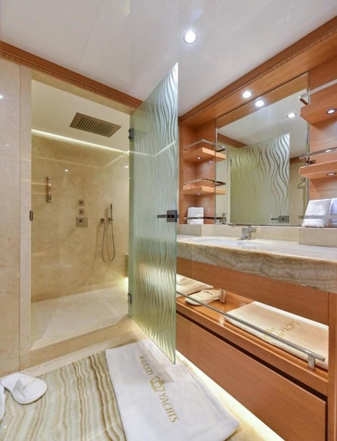 a bathroom with a shower and sink aboard 'H Yacht for Sale