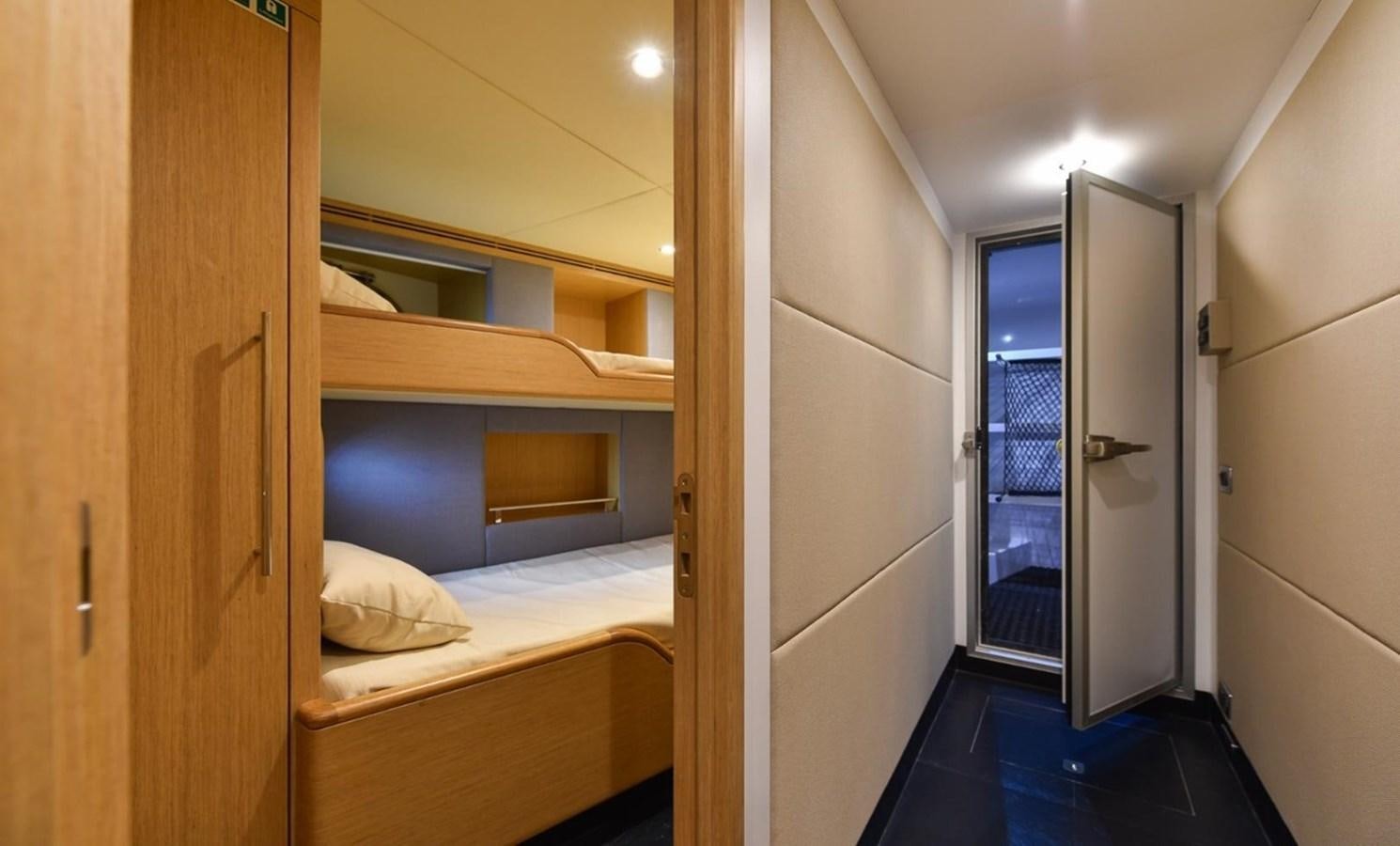 a room with a bed and a closet aboard 'H Yacht for Sale