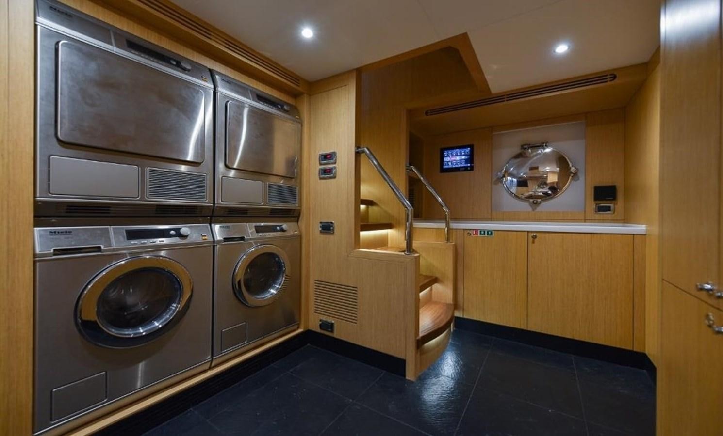 a room with a washer and dryer aboard 'H Yacht for Sale