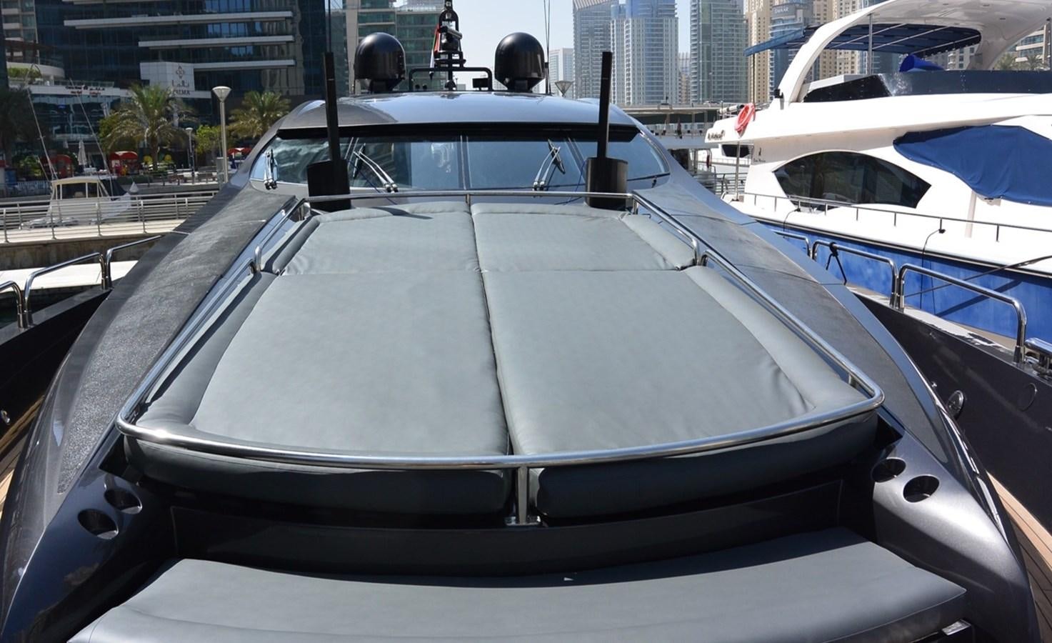 a white car parked in a harbor aboard 2004 SUNSEEKER PREDATOR 95 Yacht for Sale