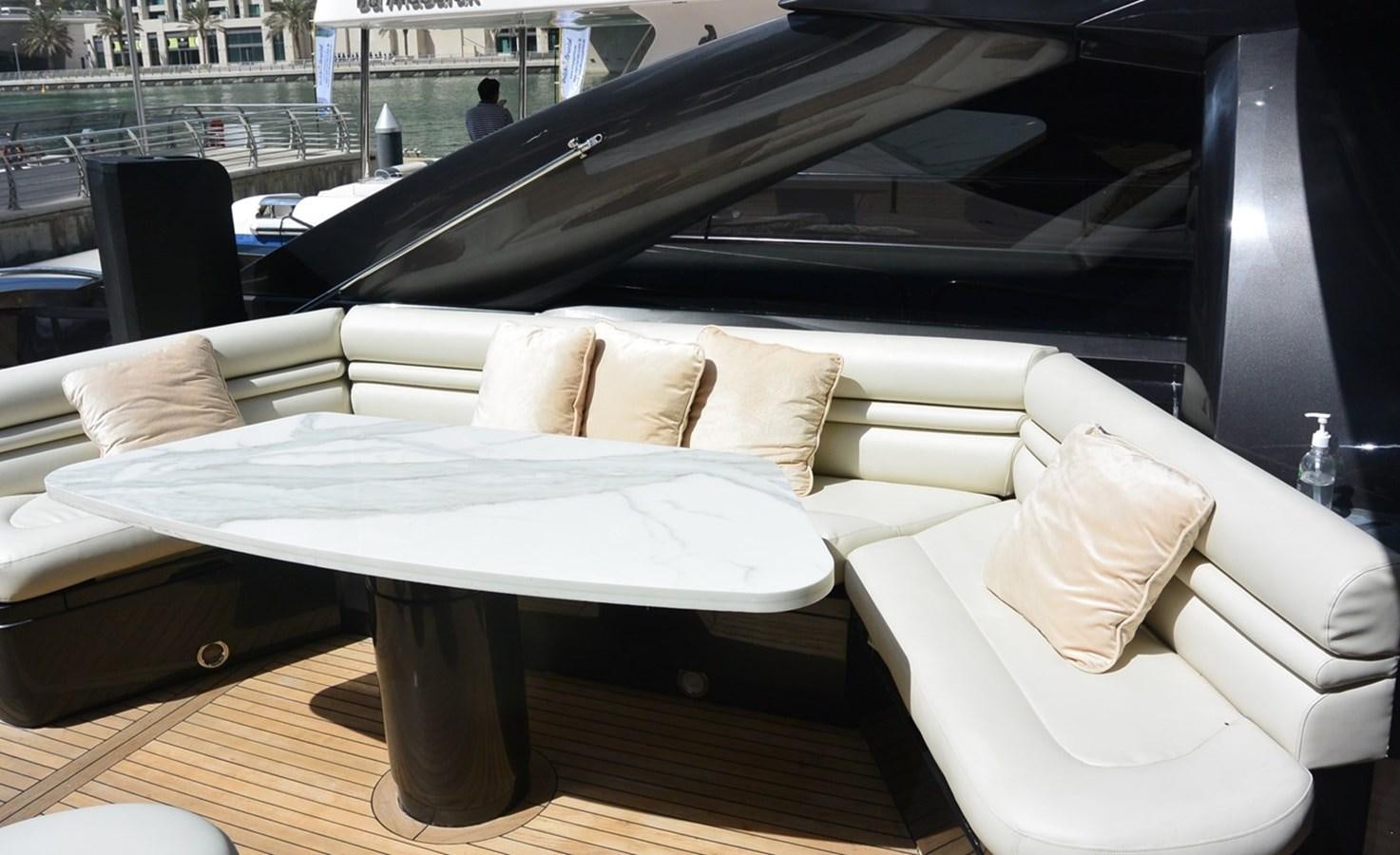 a table with pillows on it aboard 2004 SUNSEEKER PREDATOR 95 Yacht for Sale