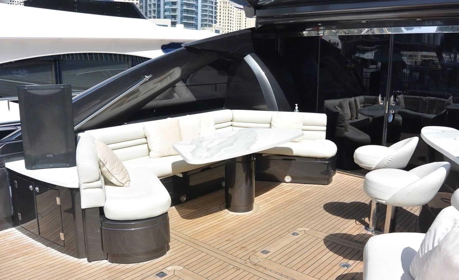a room with a table and chairs aboard 2004 SUNSEEKER PREDATOR 95 Yacht for Sale