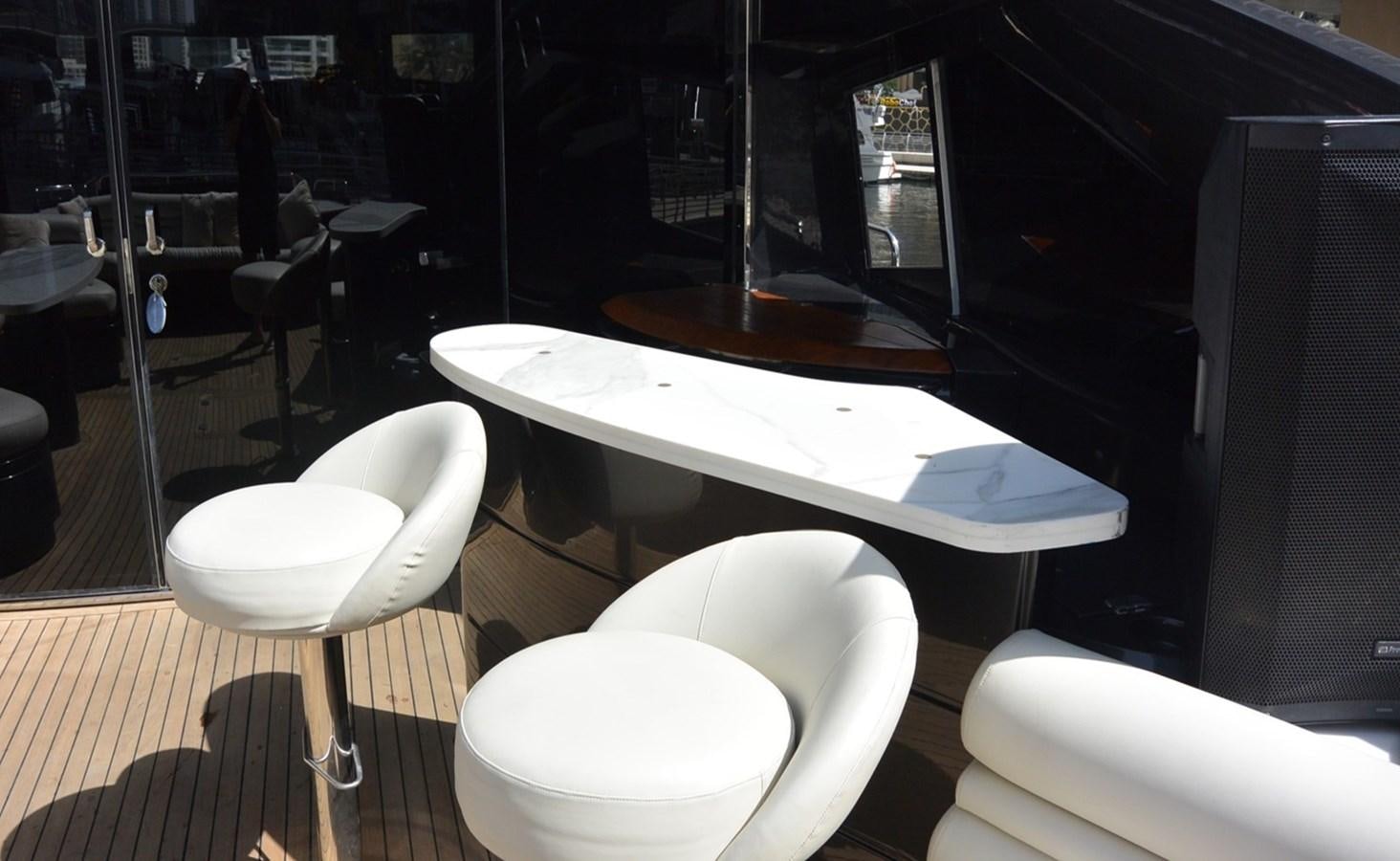 a room with a table and chairs aboard 2004 SUNSEEKER PREDATOR 95 Yacht for Sale