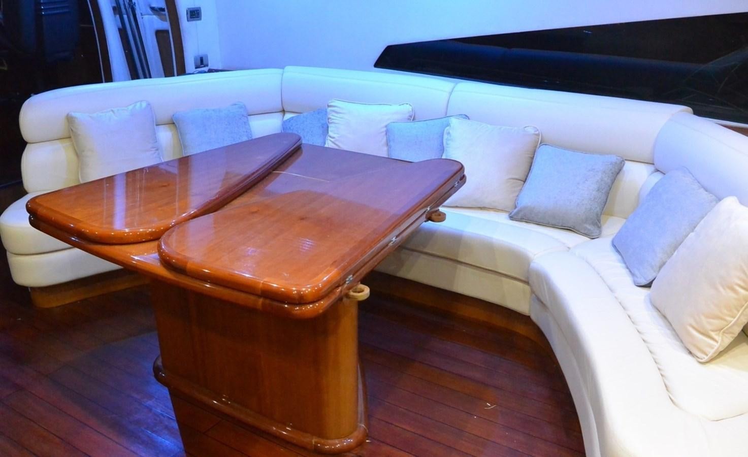 a couch and a table aboard 2004 SUNSEEKER PREDATOR 95 Yacht for Sale