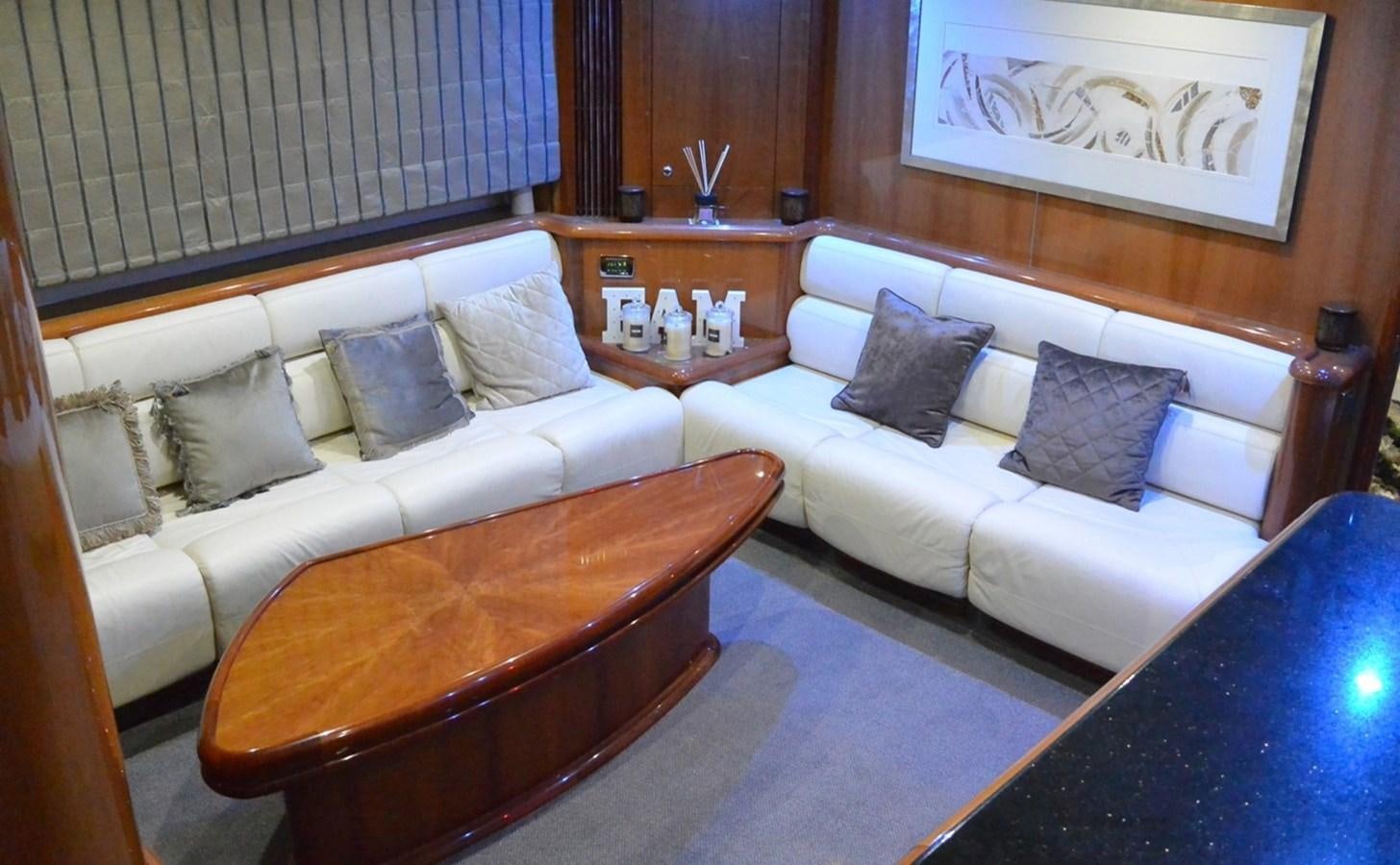 a room with a couch and a table aboard 2004 SUNSEEKER PREDATOR 95 Yacht for Sale