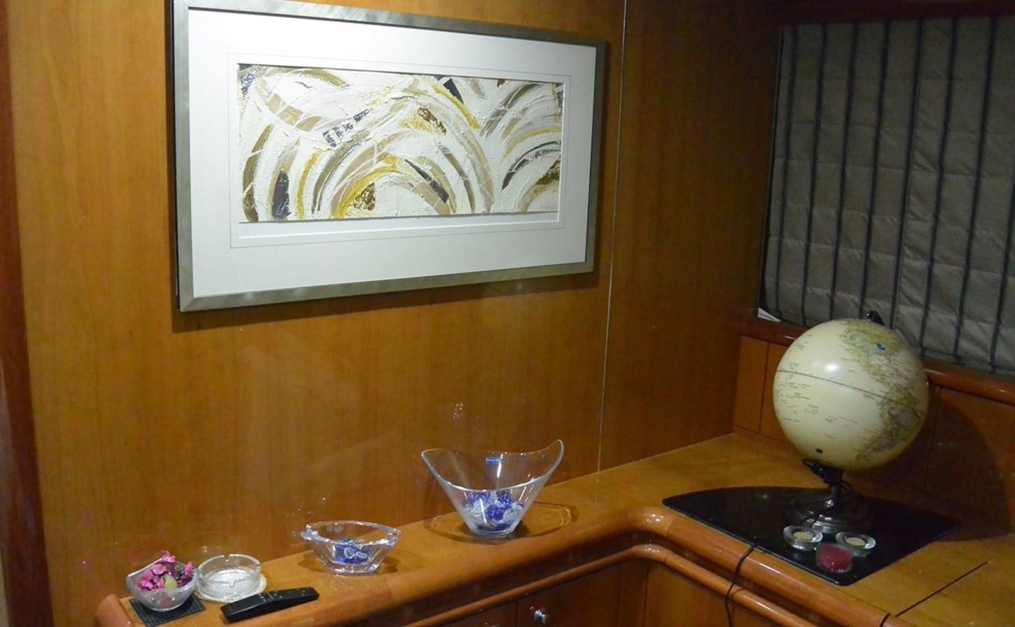 a table with a glass and a ball on it aboard 2004 SUNSEEKER PREDATOR 95 Yacht for Sale
