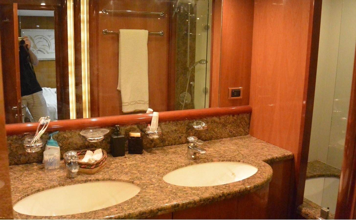 a bathroom with two sinks and a large mirror aboard 2004 SUNSEEKER PREDATOR 95 Yacht for Sale