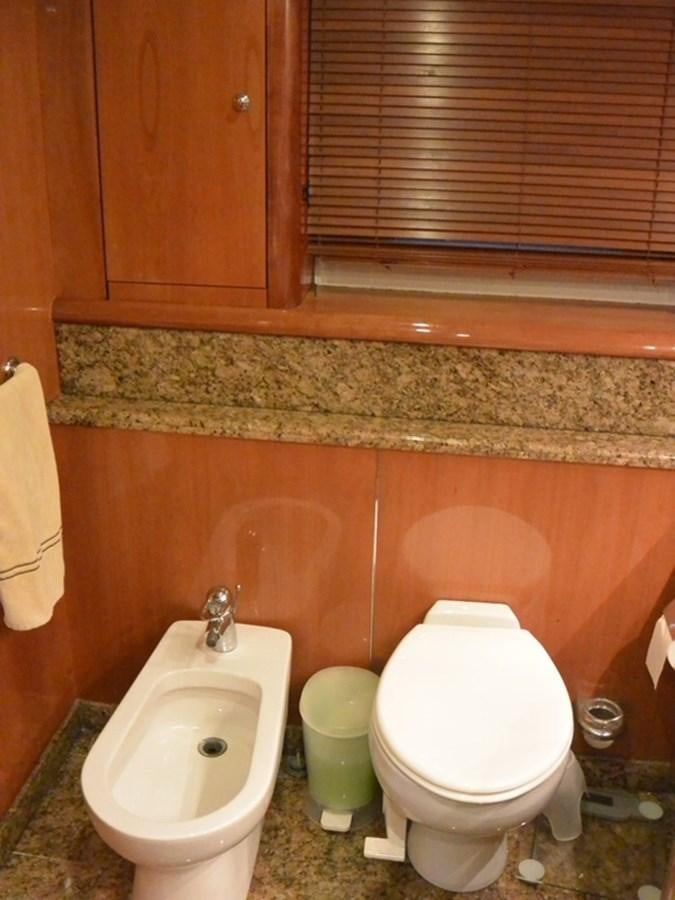 a bathroom with a toilet and a bidet aboard 2004 SUNSEEKER PREDATOR 95 Yacht for Sale