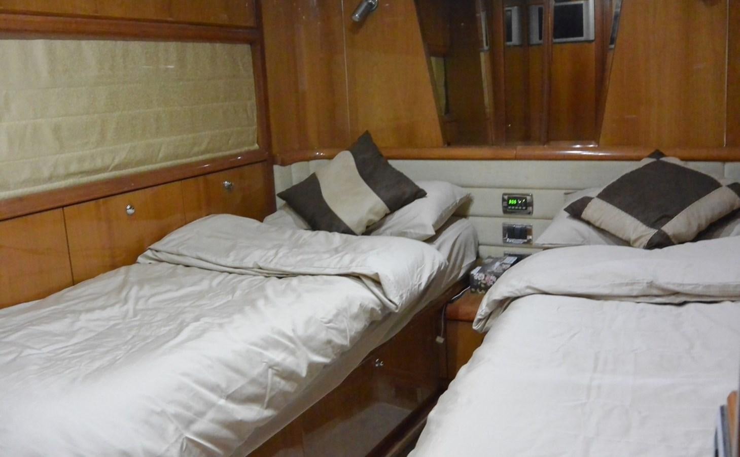 a room with two beds aboard 2004 SUNSEEKER PREDATOR 95 Yacht for Sale