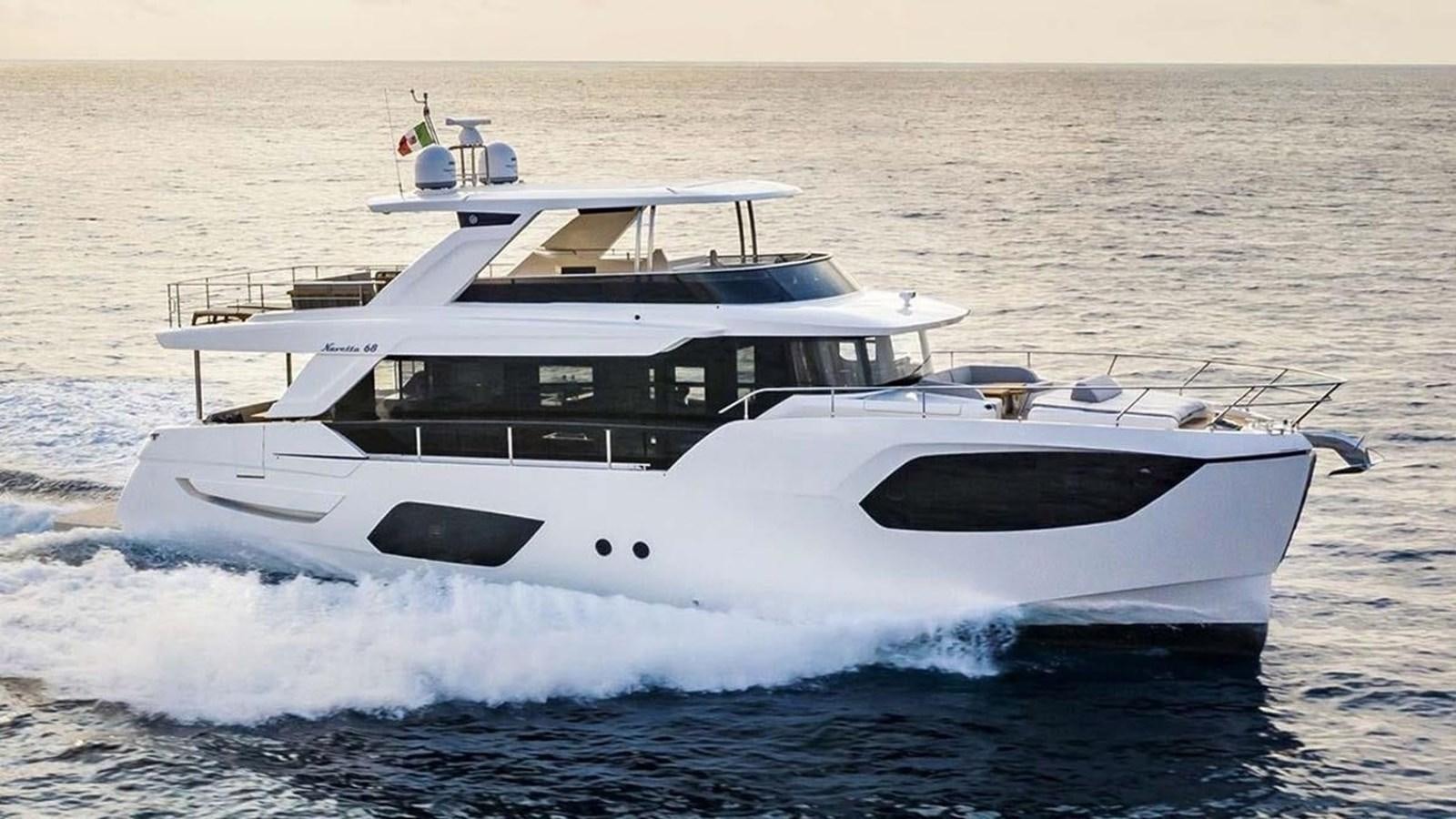 a white yacht in the water aboard LEGEND II Yacht for Sale