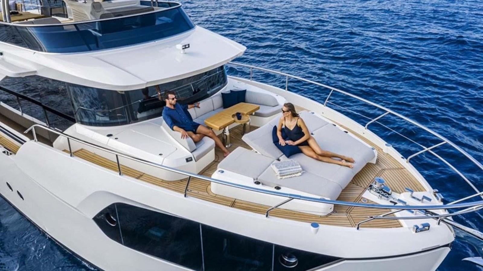 a couple of people on a boat aboard LEGEND II Yacht for Sale