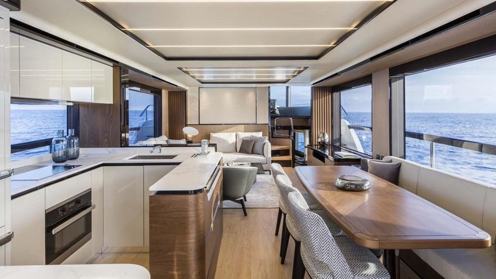 a modern looking kitchen with a large window aboard LEGEND II Yacht for Sale
