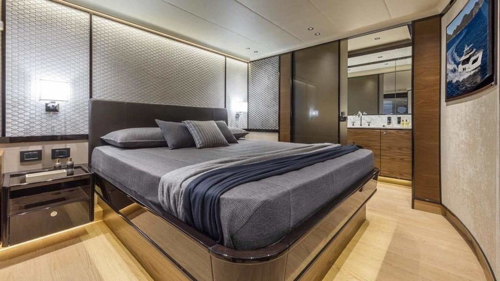 a bed in a room aboard LEGEND II Yacht for Sale