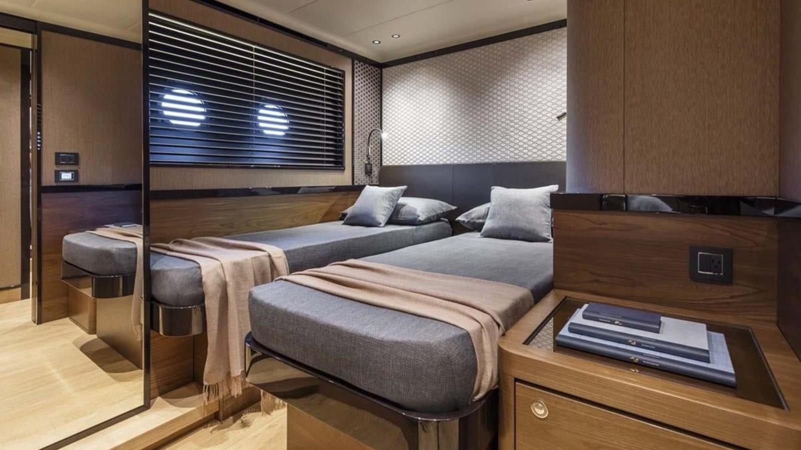 a room with two beds aboard LEGEND II Yacht for Sale