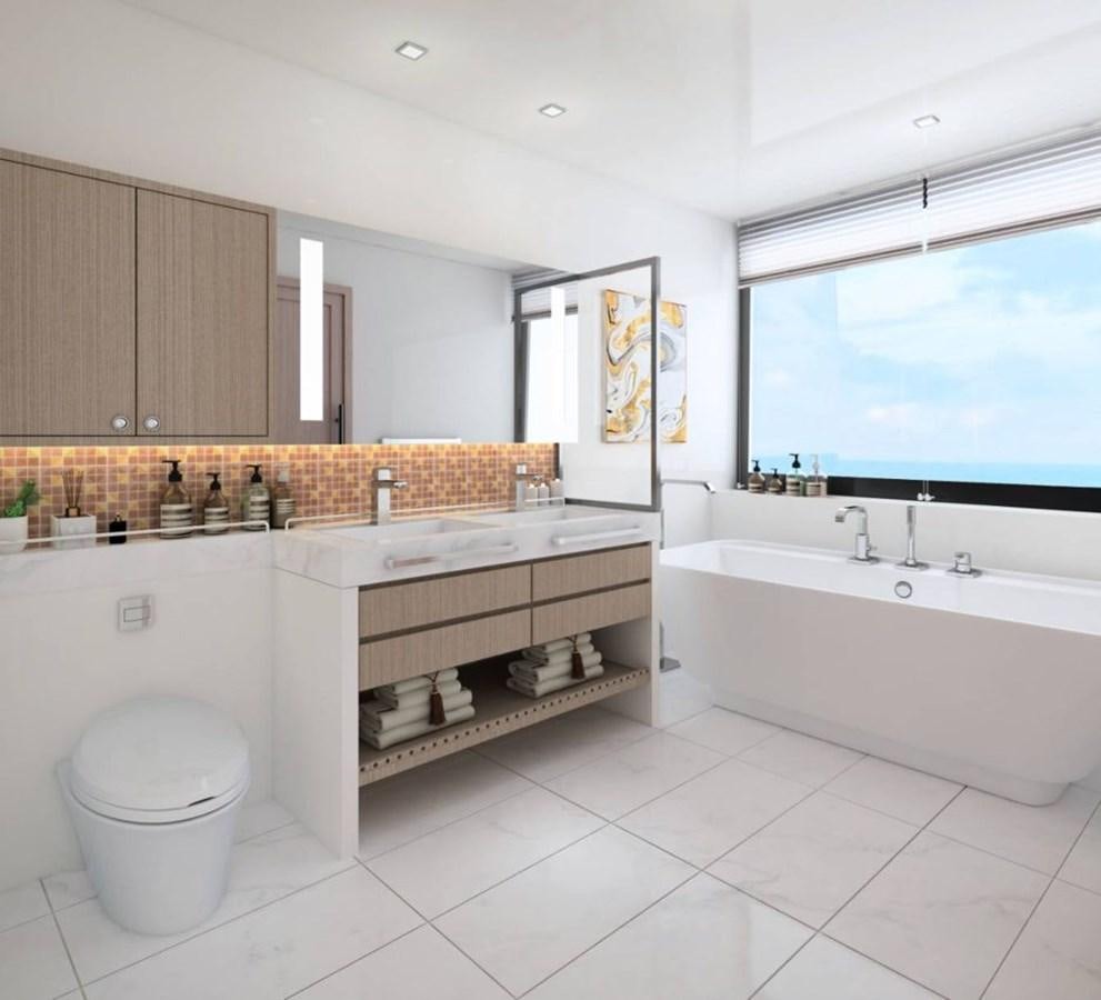 a bathroom with a tub sink and cabinets aboard INDEPENDENCE 110 Yacht for Sale