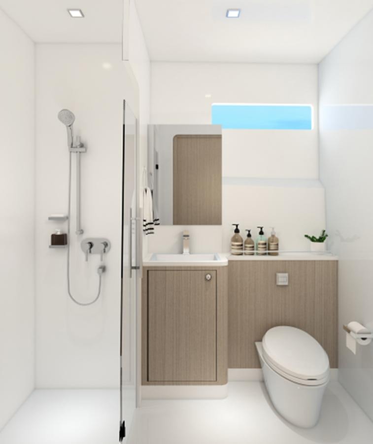 a bathroom with a toilet and sink aboard INDEPENDENCE 110 Yacht for Sale