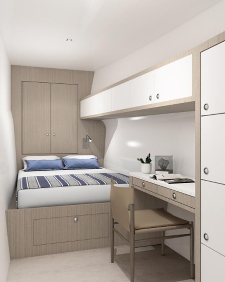a small bedroom with a bed aboard INDEPENDENCE 110 Yacht for Sale