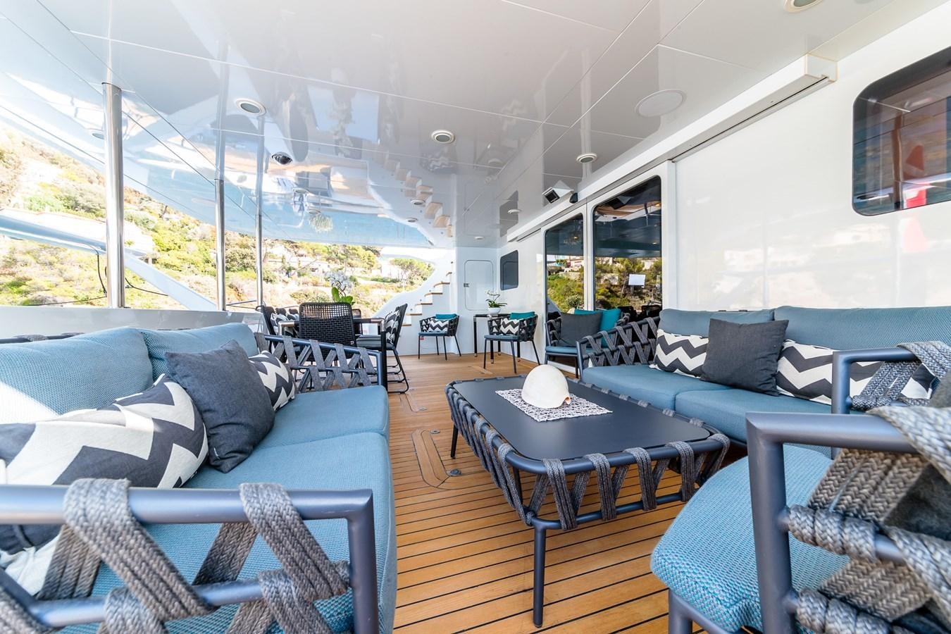 a large living room with a large patio and a large window aboard ALLURES Yacht for Sale