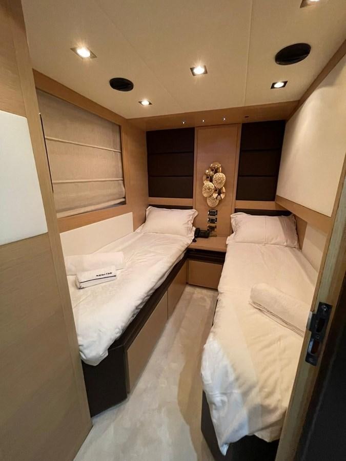 a room with two beds aboard AOP Yacht for Sale