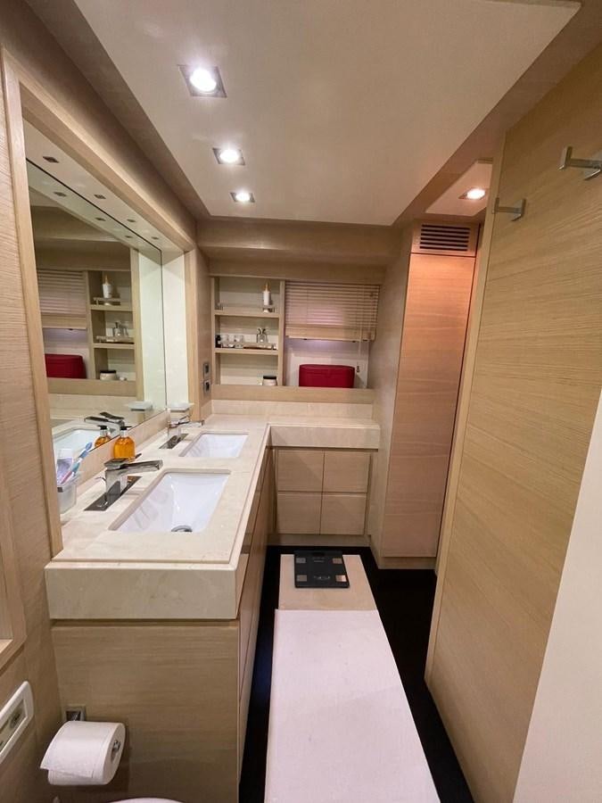 a bathroom with a sink and a mirror aboard AOP Yacht for Sale