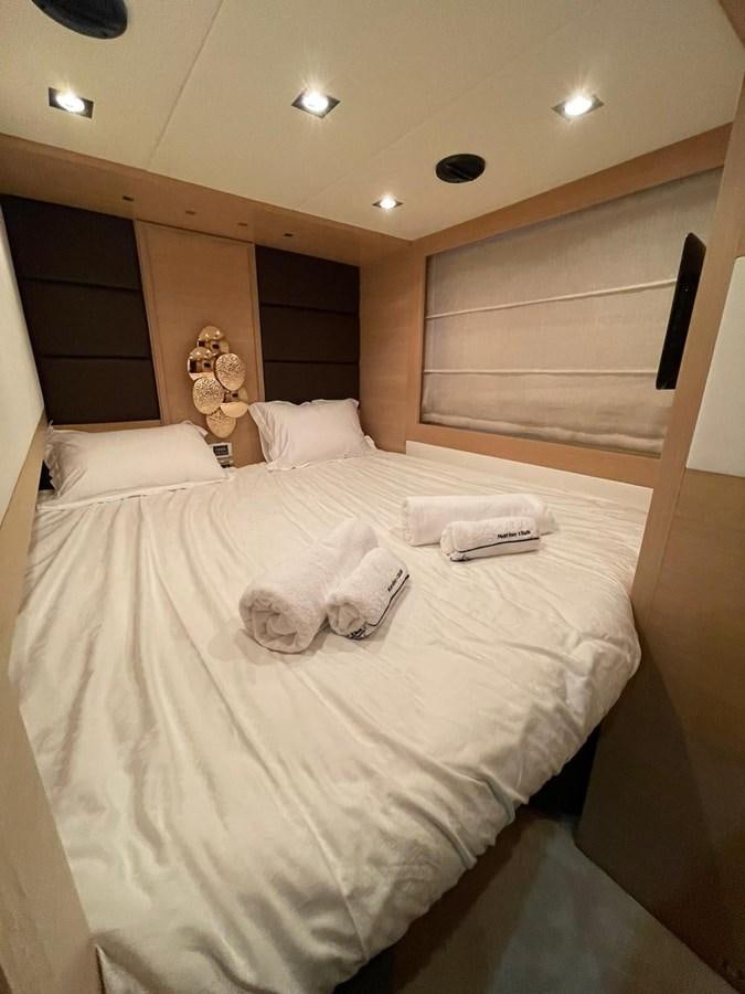 a couple of cats on a bed aboard AOP Yacht for Sale
