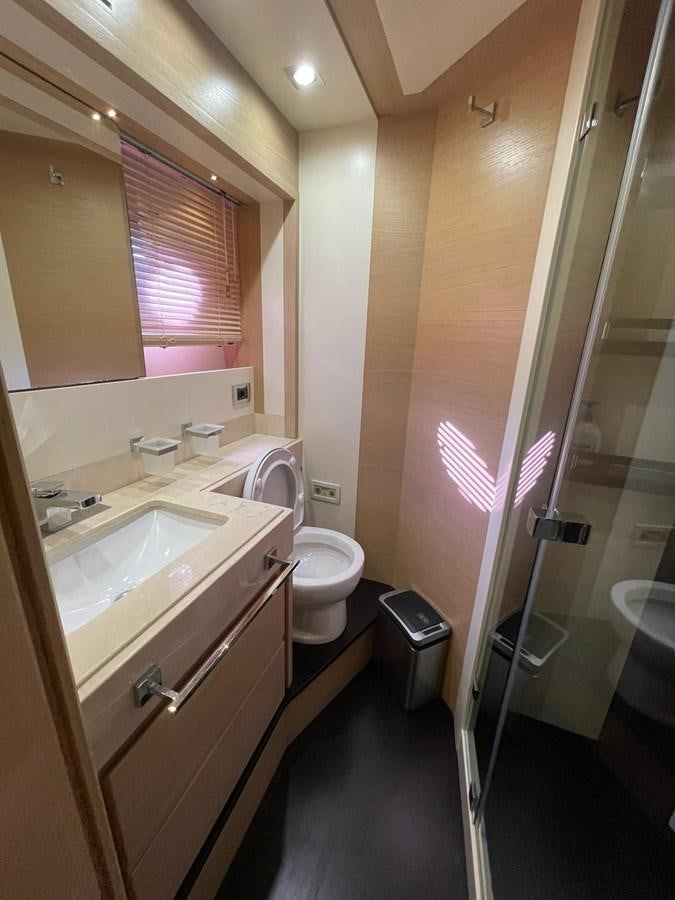 a bathroom with a sink toilet and a shower aboard AOP Yacht for Sale