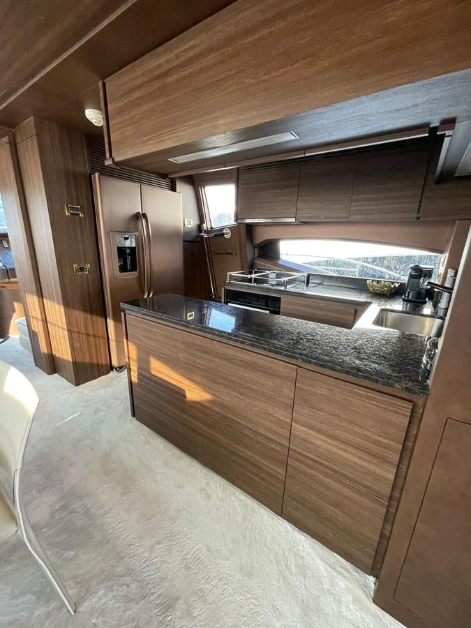 a kitchen with a large island aboard AOP Yacht for Sale