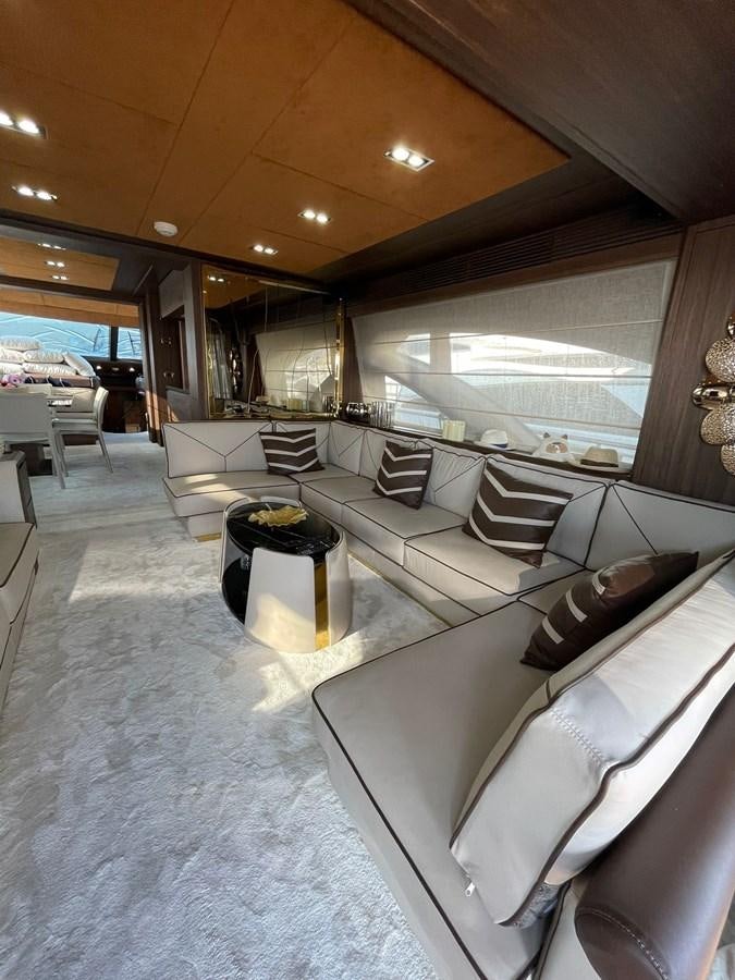 a large living room with a large window aboard AOP Yacht for Sale