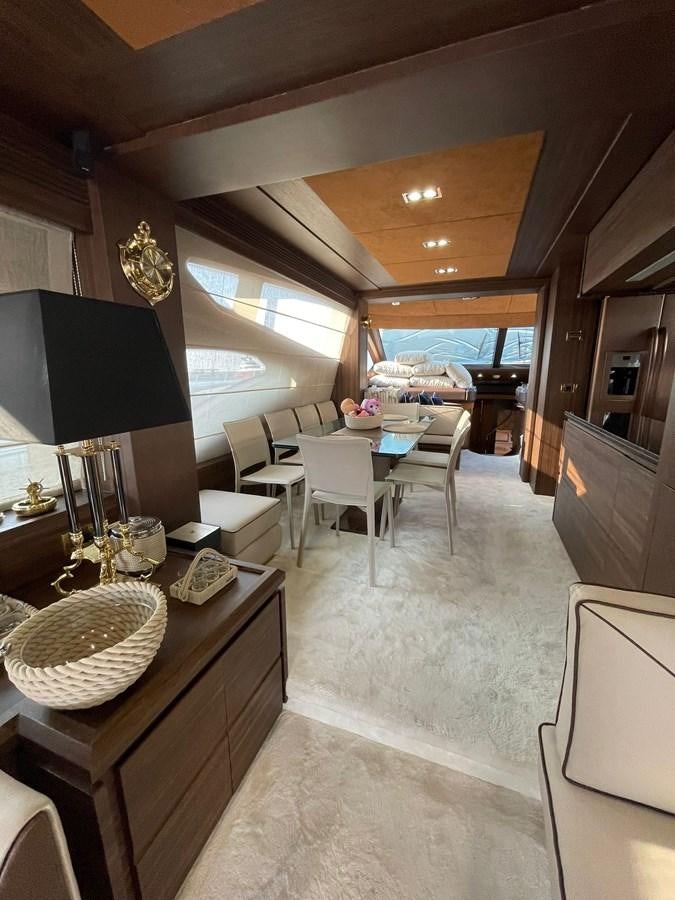 a dining room with a table and chairs aboard AOP Yacht for Sale