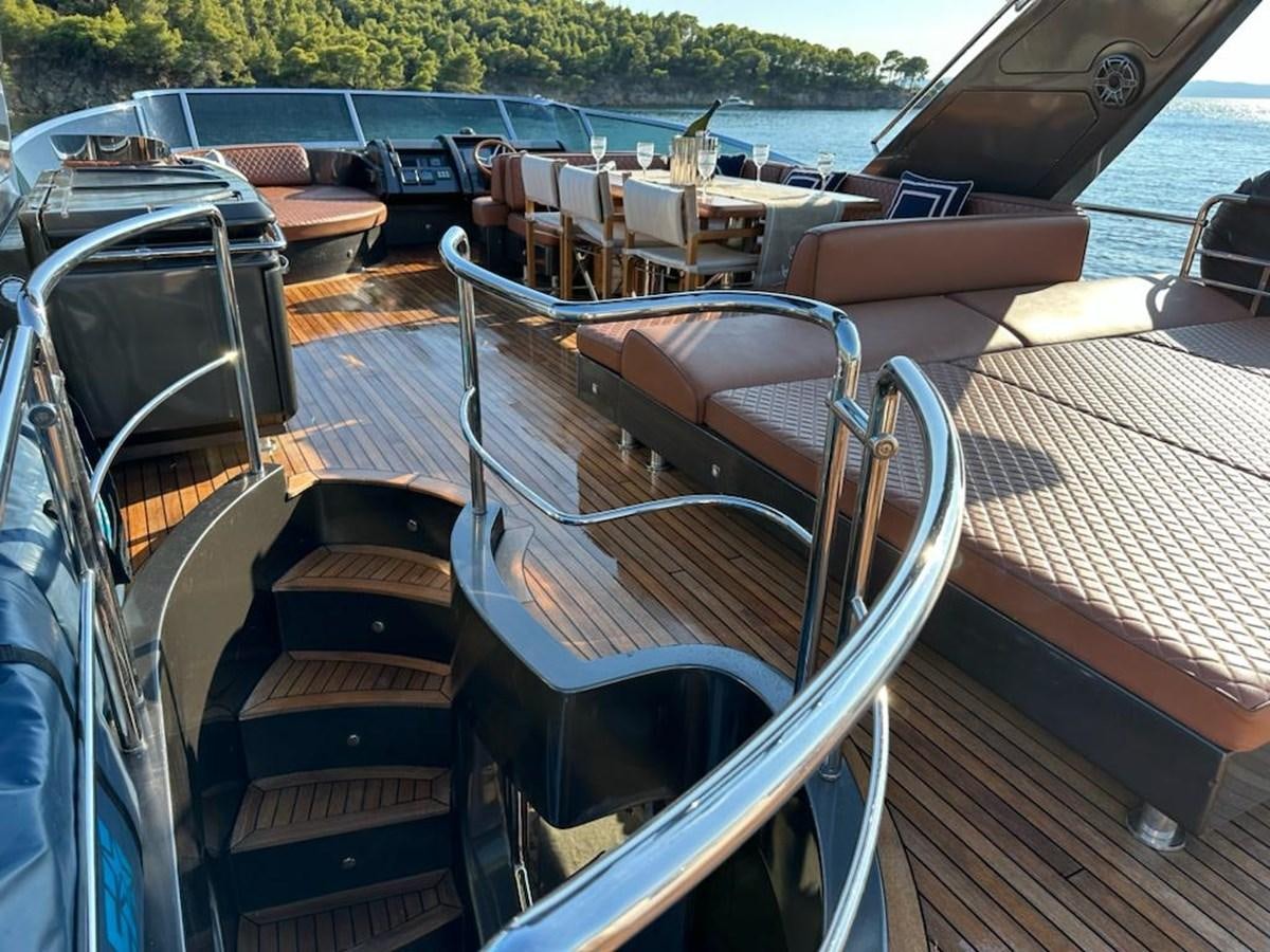 a deck with a row of boats aboard AOP Yacht for Sale