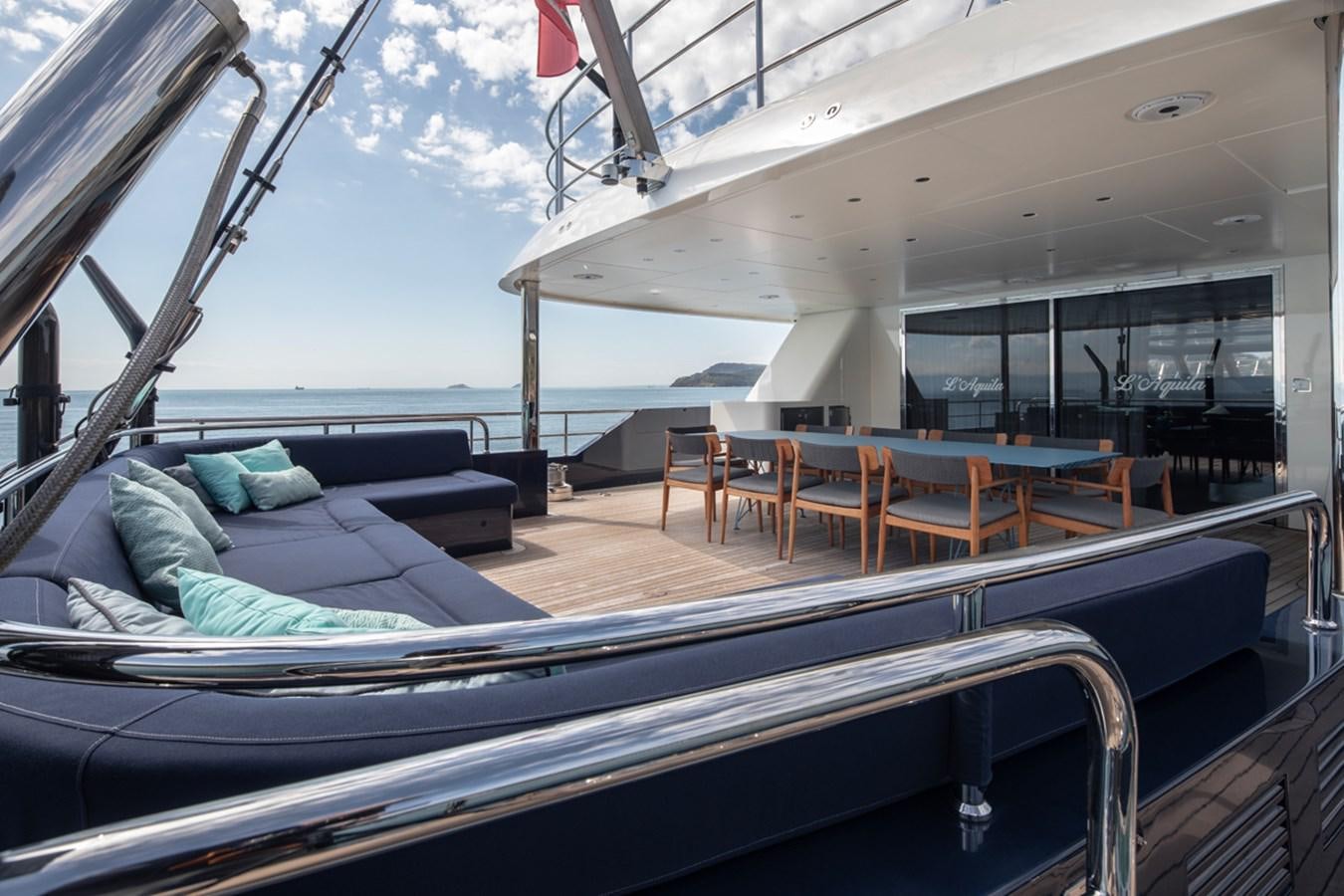 a boat with a couch and chairs aboard L'AQUILA Yacht for Sale