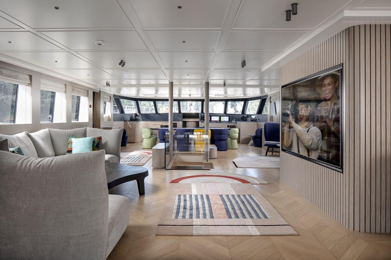 a room with a couch and a tv aboard L'AQUILA Yacht for Sale