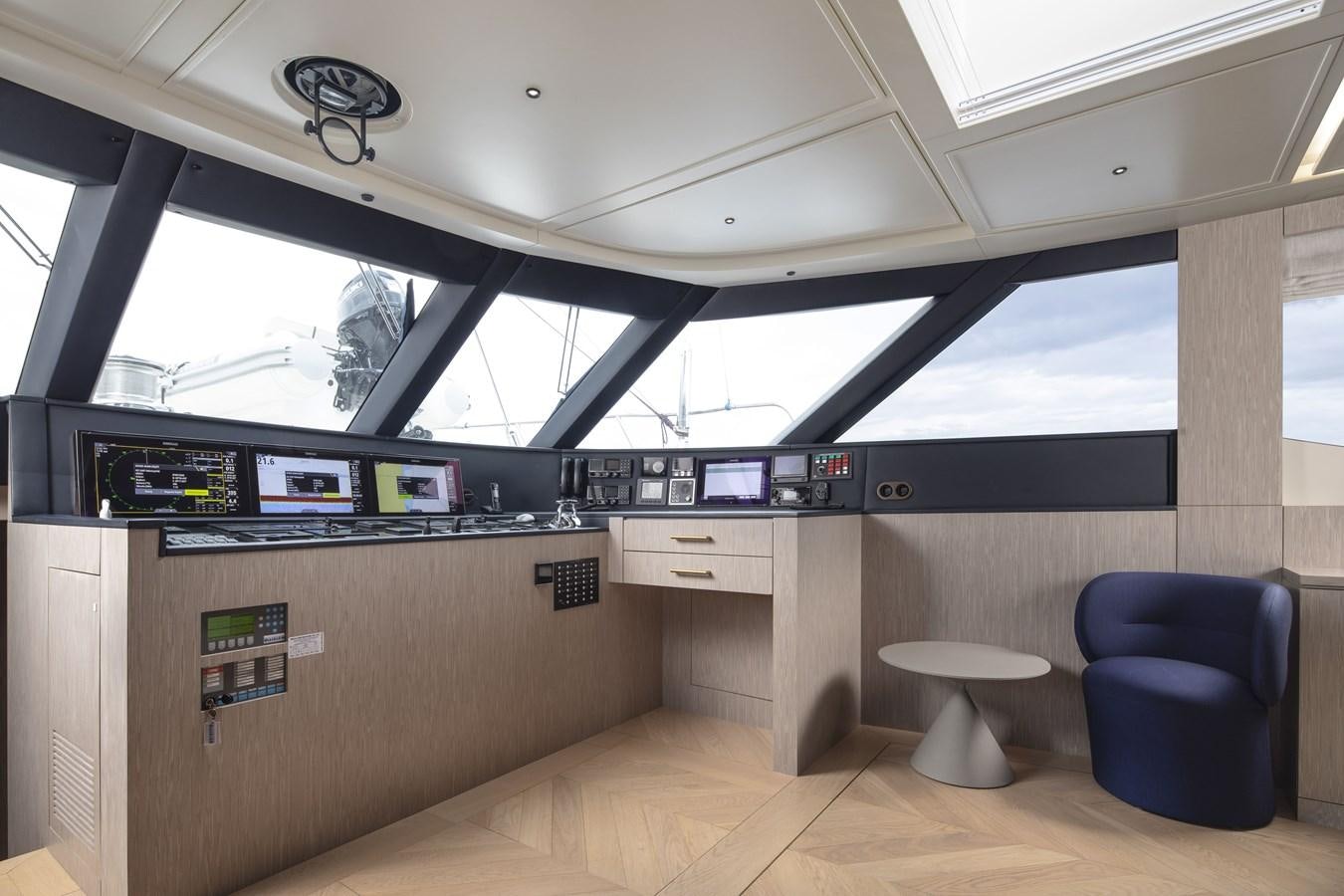 a room with a desk and chairs aboard L'AQUILA Yacht for Sale