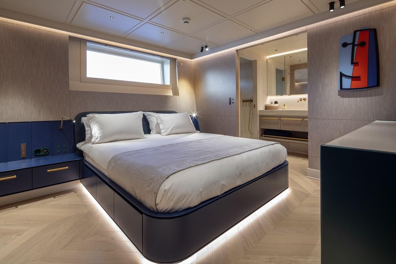a bed in a room aboard L'AQUILA Yacht for Sale