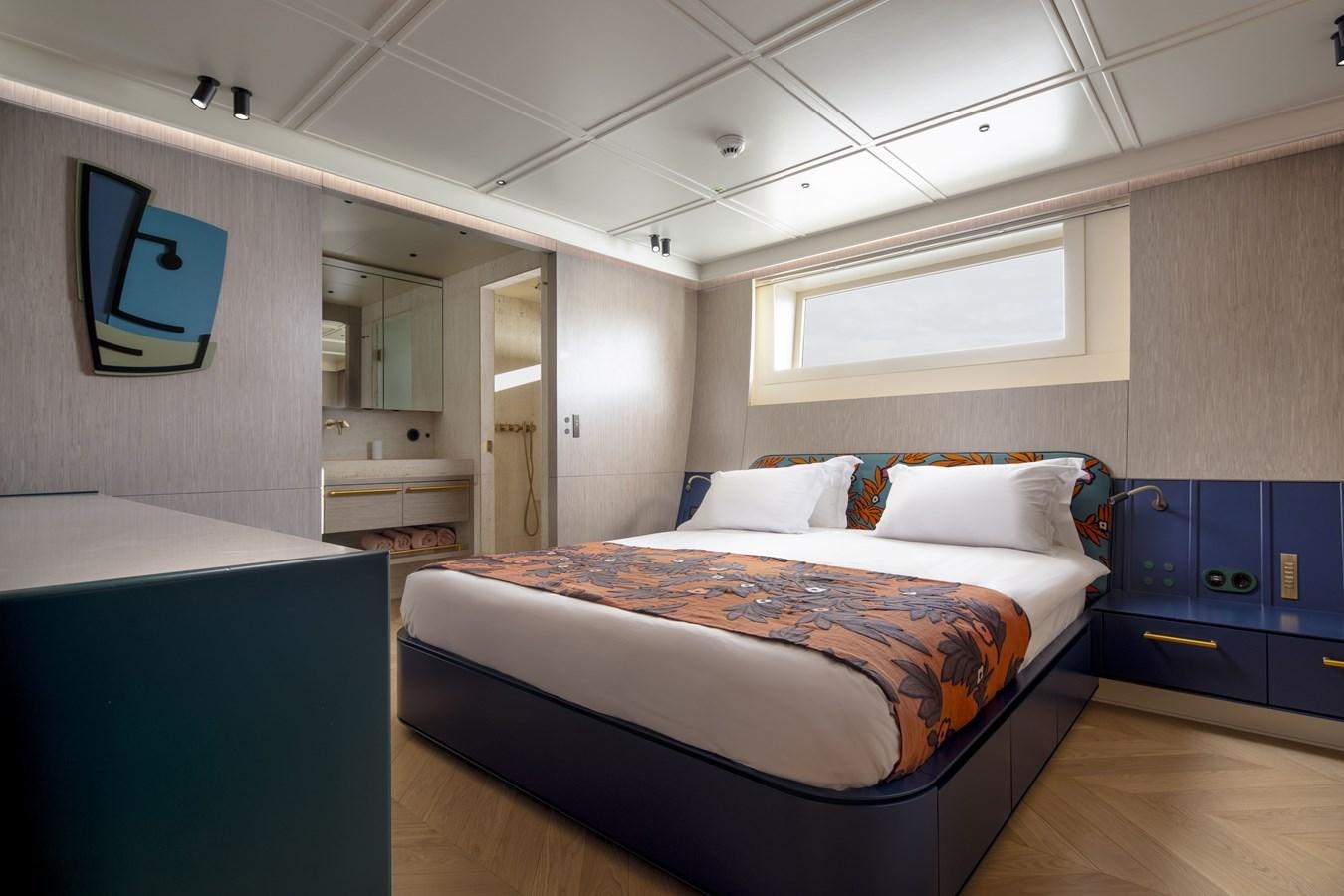 a bedroom with a bed and a television aboard L'AQUILA Yacht for Sale
