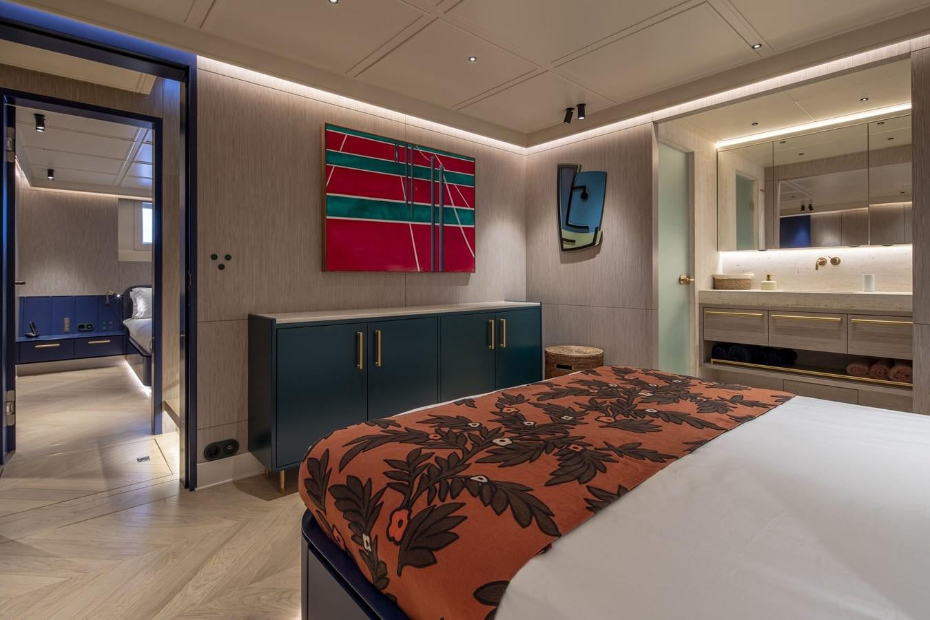 a bedroom with a large bed aboard L'AQUILA Yacht for Sale